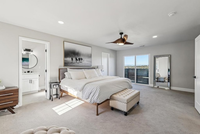 bedroom with ceiling fan, ensuite bathroom, access to exterior, and light carpet