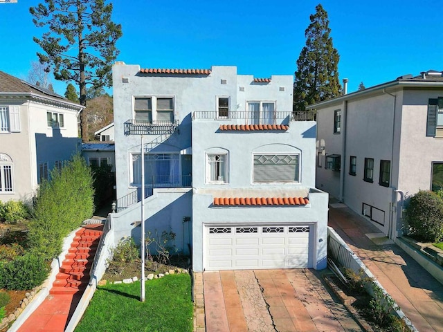 mediterranean / spanish home featuring a garage