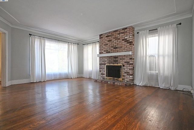 unfurnished living room featuring a fireplace, crown molding, and dark hardwood / wood-style floors