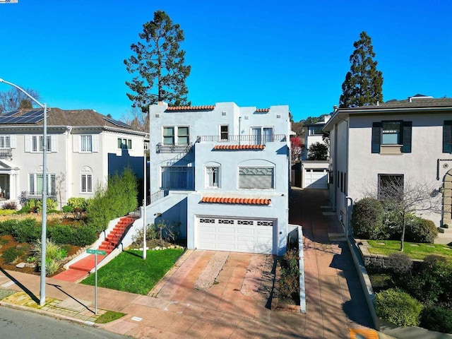 mediterranean / spanish home with a garage