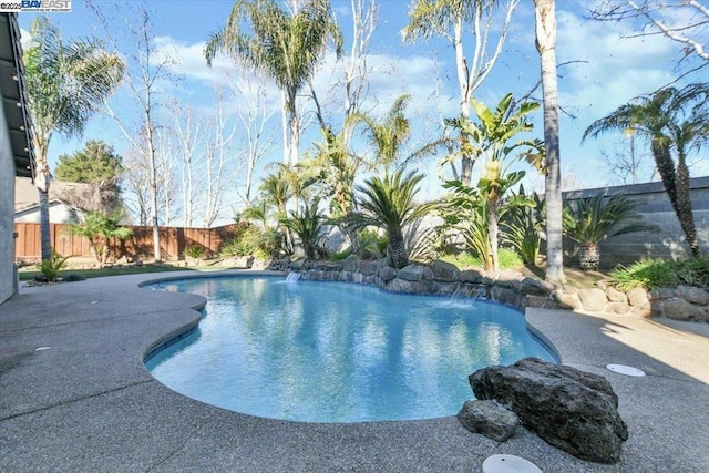 view of swimming pool featuring a patio area and pool water feature