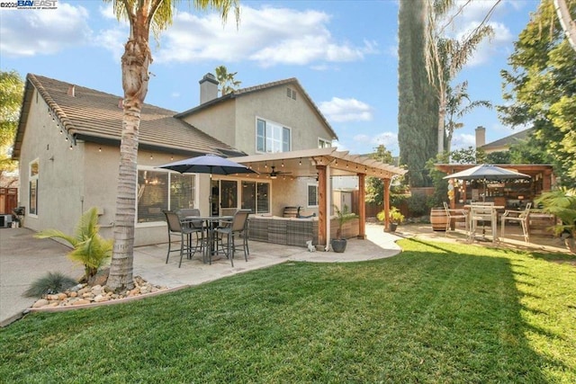 back of house with a yard, an outdoor hangout area, ceiling fan, a pergola, and a patio area