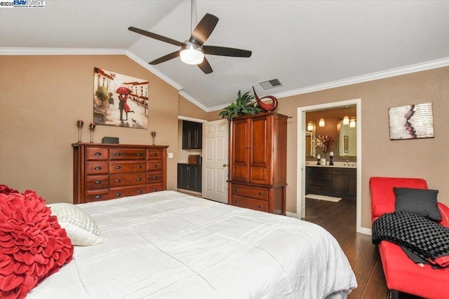 bedroom with vaulted ceiling, ornamental molding, ceiling fan, dark wood-type flooring, and ensuite bath