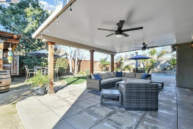 view of patio featuring an outdoor hangout area and ceiling fan