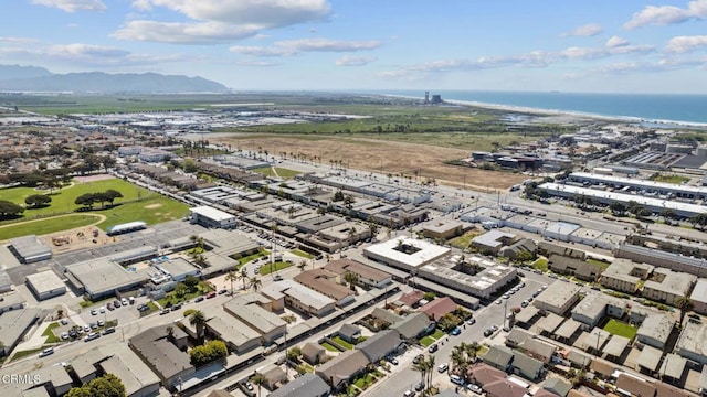 birds eye view of property featuring a water and mountain view