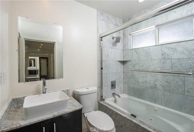 full bathroom with toilet, vanity, and combined bath / shower with glass door