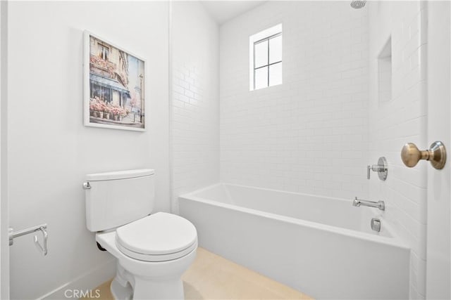 bathroom with toilet and shower / bathing tub combination