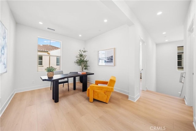 office with light hardwood / wood-style floors