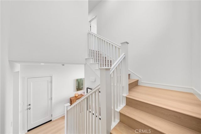 stairway with wood-type flooring