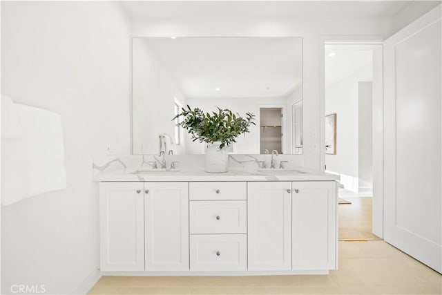 bathroom with tile patterned flooring and vanity