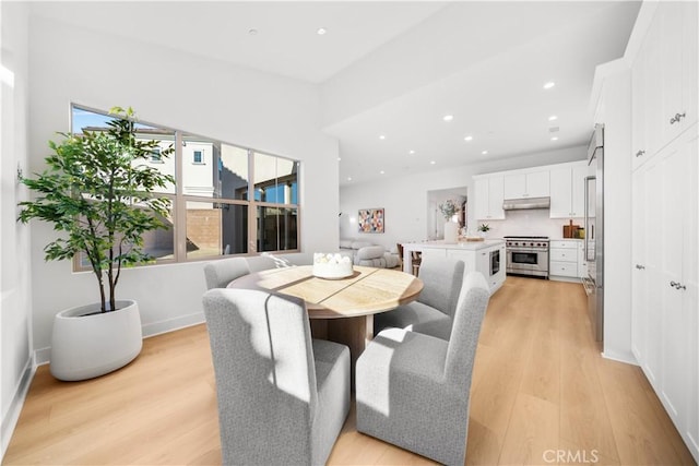 dining area with light hardwood / wood-style floors