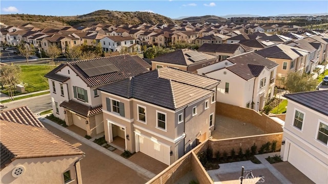 birds eye view of property with a mountain view