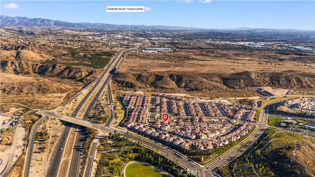 drone / aerial view featuring a mountain view