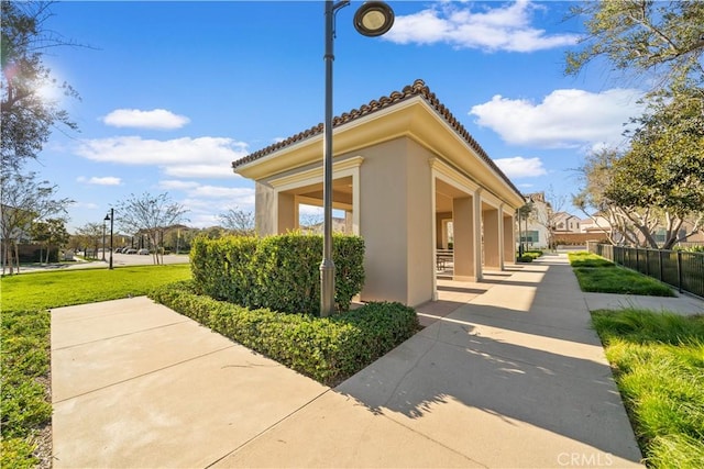 view of side of property with a yard