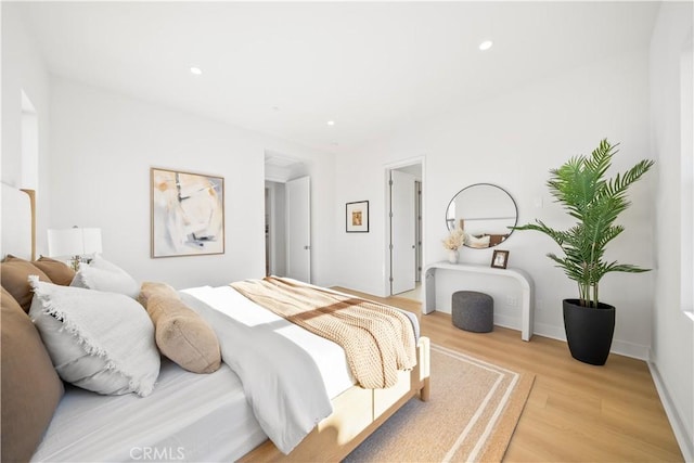 bedroom with light hardwood / wood-style floors