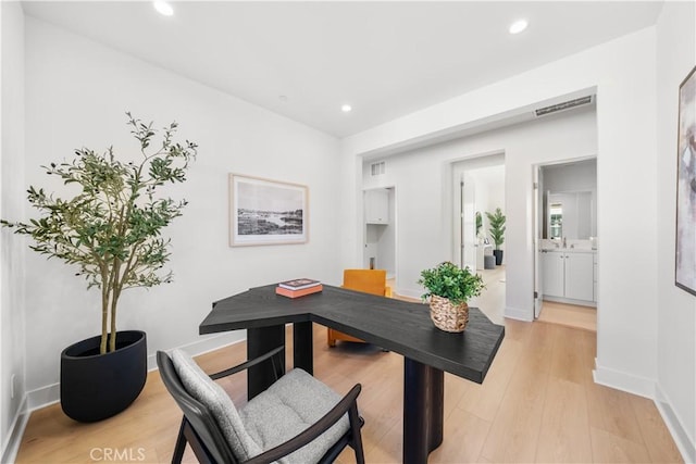 home office with light wood-type flooring