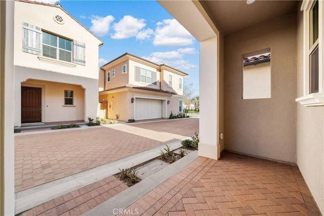 view of patio / terrace featuring a garage