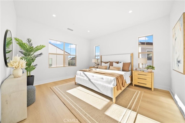 bedroom with wood-type flooring