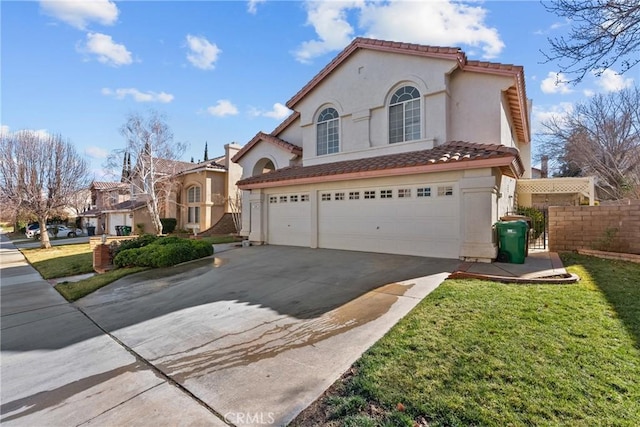 mediterranean / spanish house with a front lawn and a garage