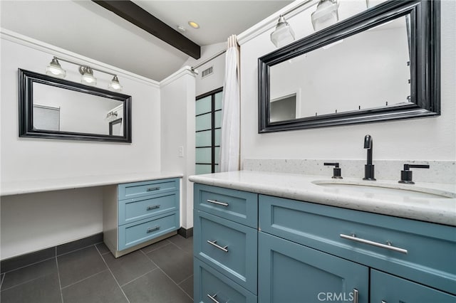 bathroom featuring tile patterned flooring, lofted ceiling with beams, and vanity