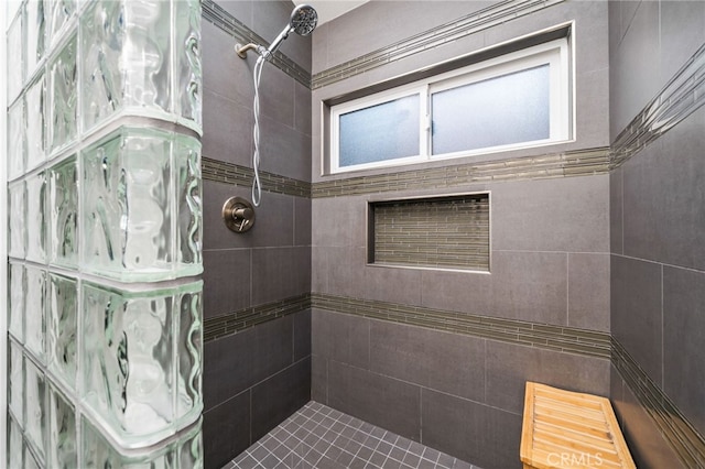 bathroom with tiled shower