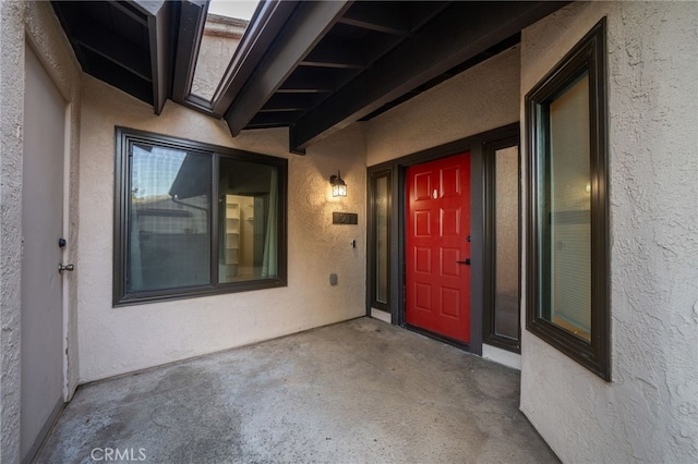 entrance to property featuring a patio area