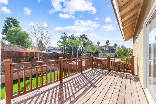 wooden terrace with a yard