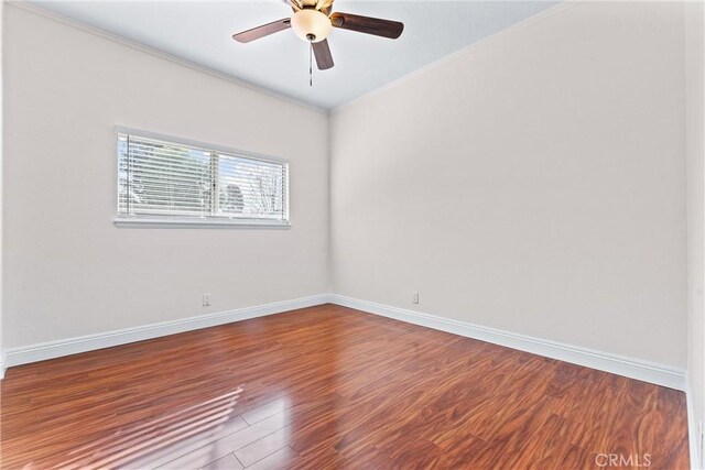 spare room featuring ceiling fan, ornamental molding, and hardwood / wood-style floors