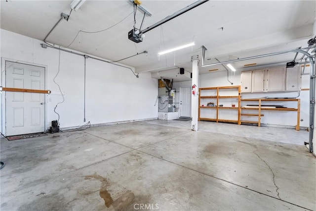 garage with a garage door opener and heating unit