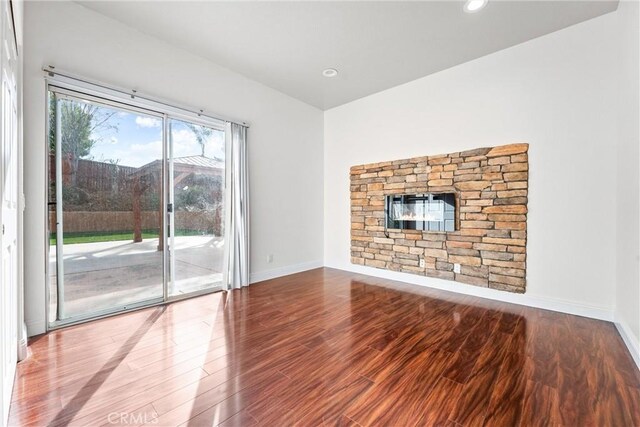 unfurnished living room with hardwood / wood-style floors