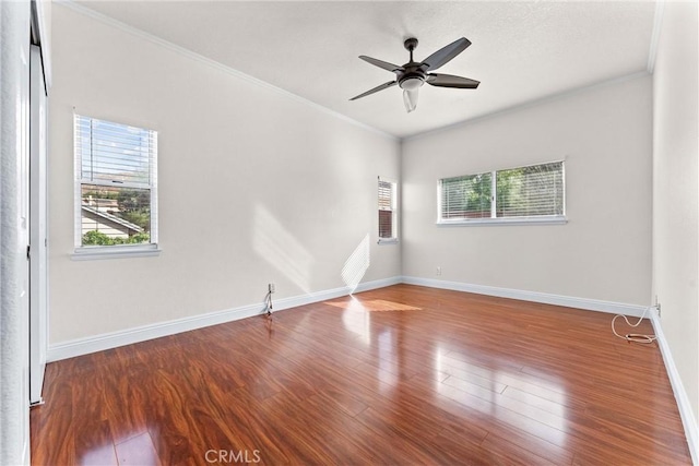 unfurnished room featuring ceiling fan, ornamental molding, and wood-type flooring