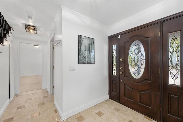 foyer featuring ornamental molding and a wealth of natural light