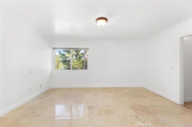 spare room with ornamental molding