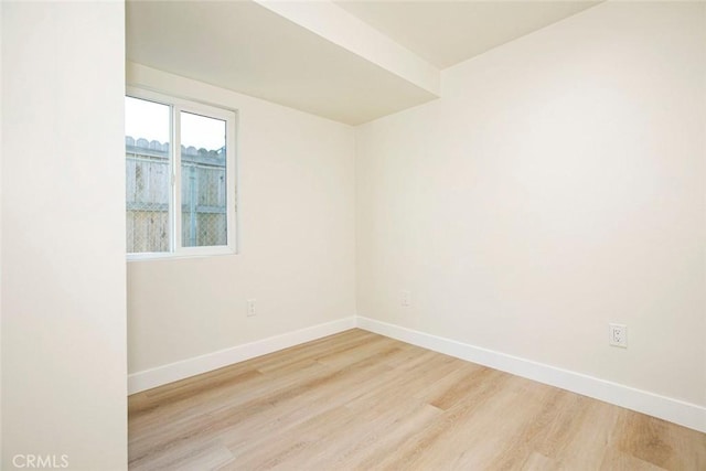 spare room featuring light hardwood / wood-style floors