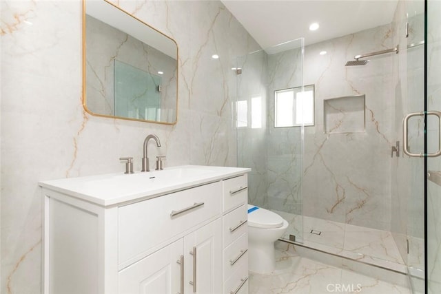 bathroom with toilet, walk in shower, tile walls, and vanity