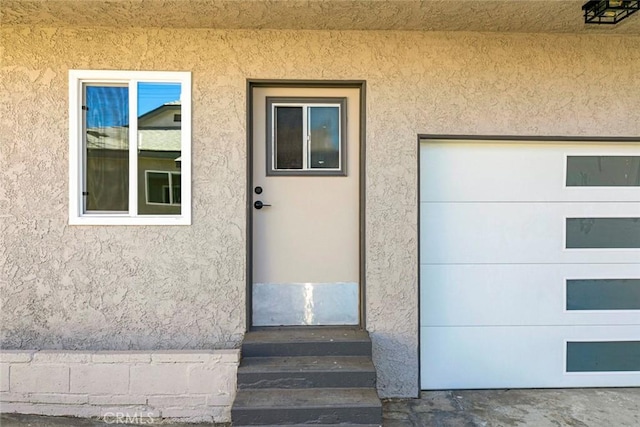 entrance to property with a garage