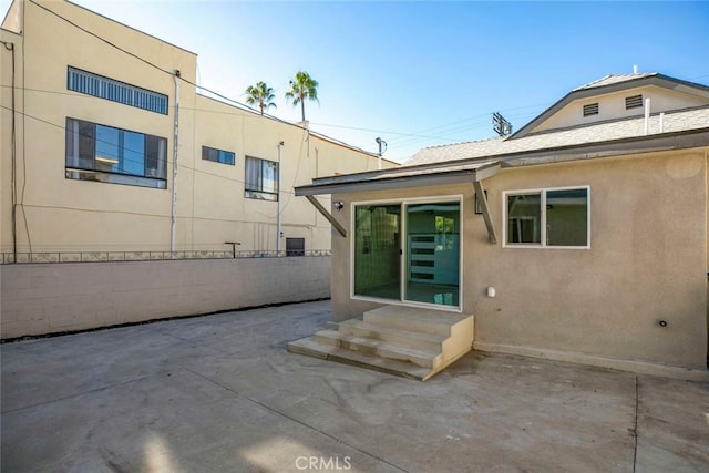 rear view of house with a patio