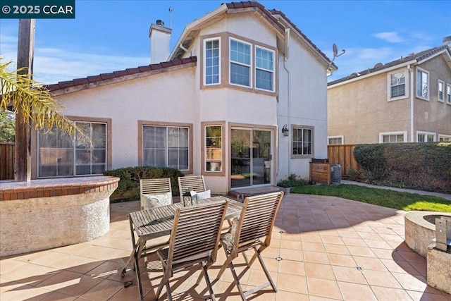 back of house with a patio