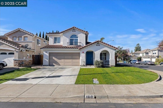 mediterranean / spanish-style home with a garage and a front lawn