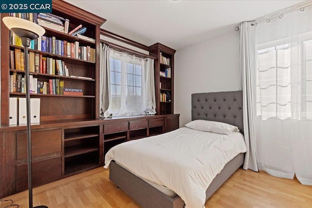 bedroom with light hardwood / wood-style flooring