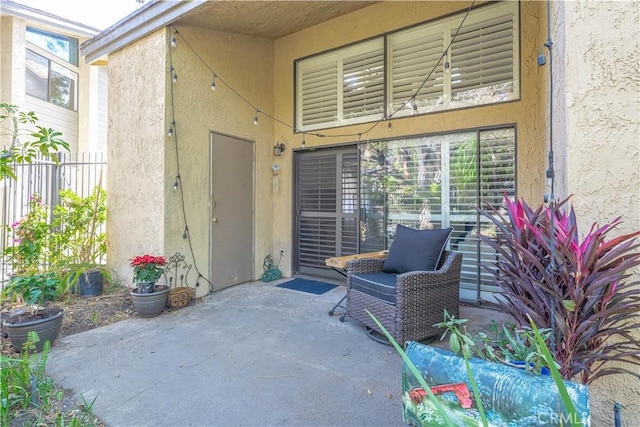 4900 E Chapman Ave Unit 24, Orange, CA 92869 - doorway to property with stucco siding and a patio area
