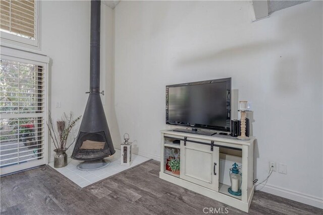 4900 E Chapman Ave Unit 24, Orange, CA 92869 - living room with a wood stove and wood finished floors