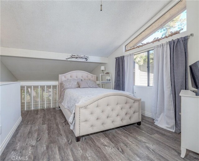 4900 E Chapman Ave Unit 24, Orange, CA 92869 - bedroom featuring lofted ceiling, a textured ceiling, and wood finished floors