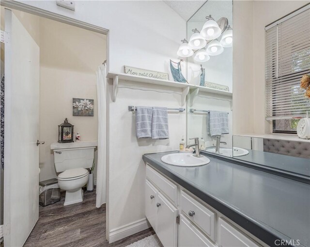 4900 E Chapman Ave Unit 24, Orange, CA 92869 - full bathroom featuring wood finished floors, vanity, and curtained shower