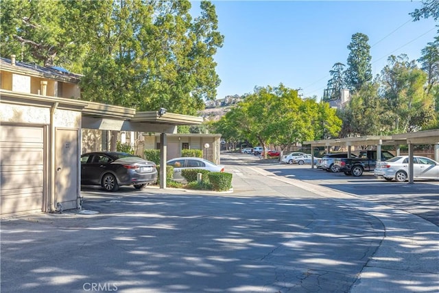 view of car parking featuring a carport