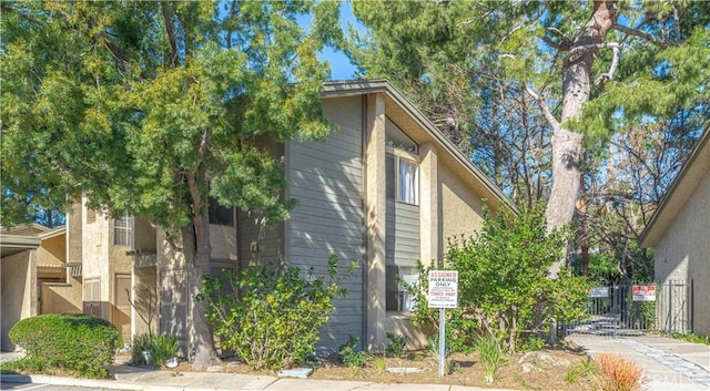 view of home's exterior featuring fence