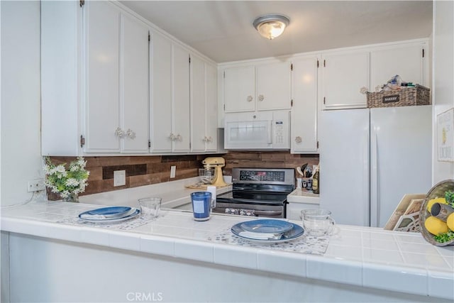 4900 E Chapman Ave Unit 24, Orange, CA 92869 - kitchen featuring white appliances, decorative backsplash, and white cabinets