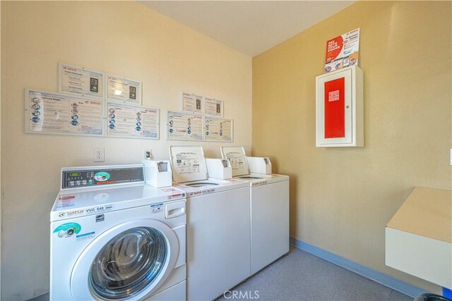 washroom with washing machine and dryer