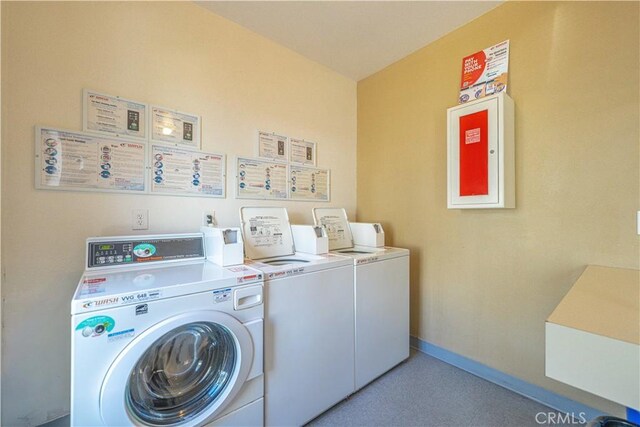 4900 E Chapman Ave Unit 24, Orange, CA 92869 - community laundry with baseboards and washer and clothes dryer