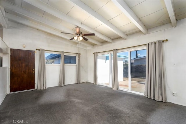 carpeted spare room with ceiling fan and lofted ceiling with beams